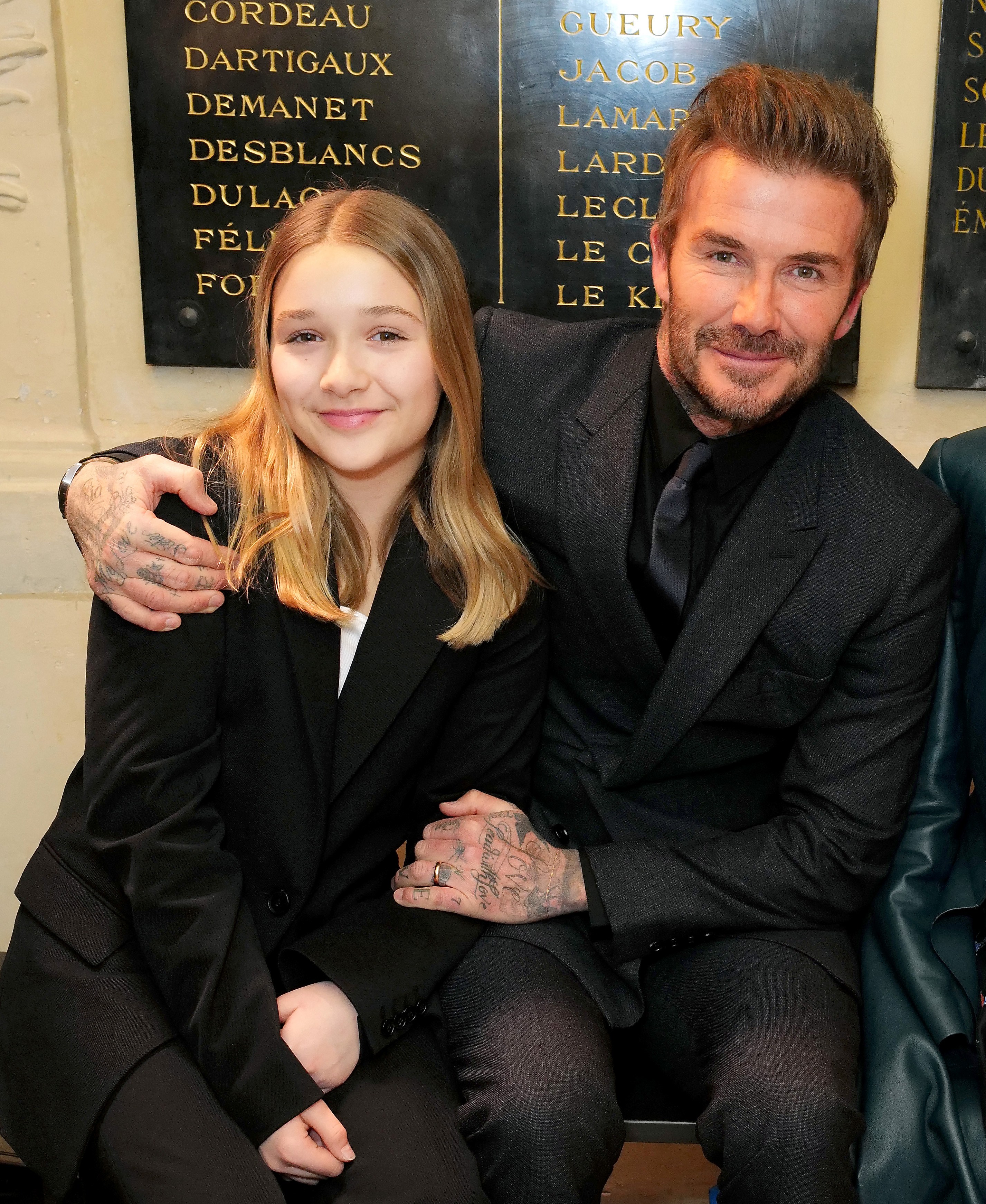 Harper Beckham with her father, David, at Paris Fashion Week